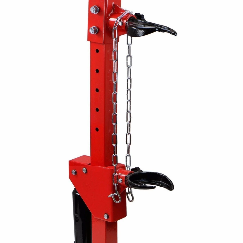 Vista lateral del compresor de muelles hidráulico con pedal y ganchos ajustables